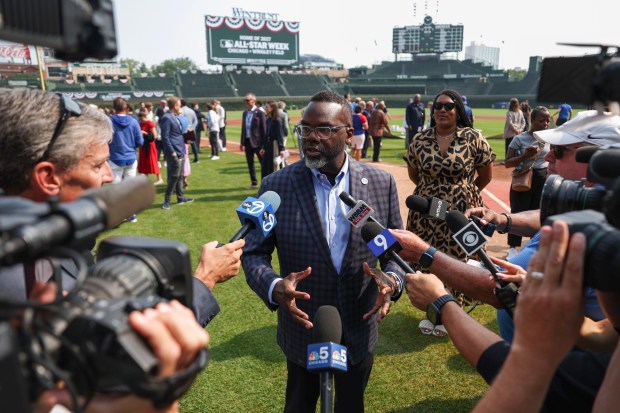 Mayor Brandon Johnson answers questions at Wrigley Field on Friday,...