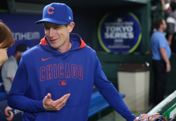 Cubs manager Craig Counsell talks with a reporter during a team workout in preparation for the Tokyo Series against the Dodgers at the Tokyo Dome on March 14, 2025, in Tokyo. (John J. Kim/Chicago Tribune)