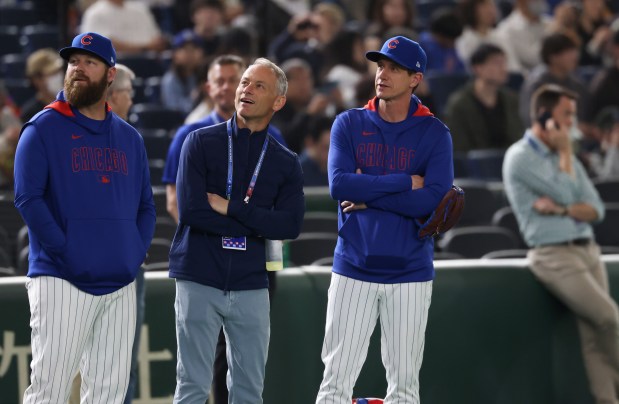 Cubs hitting coach Dustin Kelly, from left, President Jed Hoyer and manager Craig Counsell watch a team workout in preparation for the Tokyo Series against the Dodgers on March 14, 2025. (John J. Kim/Chicago Tribune)