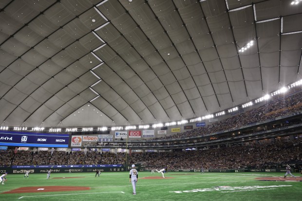 Cubs pitcher Tyson Miller throws against the Hanshin Tigers in the fourth inning of an exhibition game at the Tokyo Dome on March 15, 2025. (John J. Kim/Chicago Tribune)