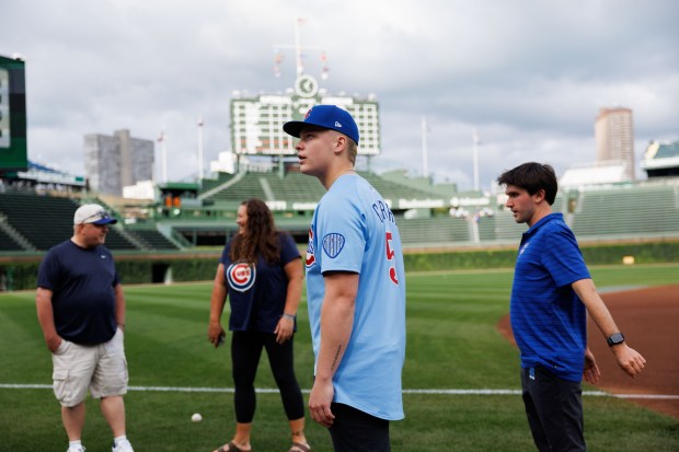 Ethan Conrad, who the Cubs selected at No. 17 in the first round of the 2025 MLB draft, walks on the field before the Cubs play the Milwaukee Brewers at Wrigley Field Wednesday Aug. 20, 2025, in Chicago. (Armando L. Sanchez/Chicago Tribune)