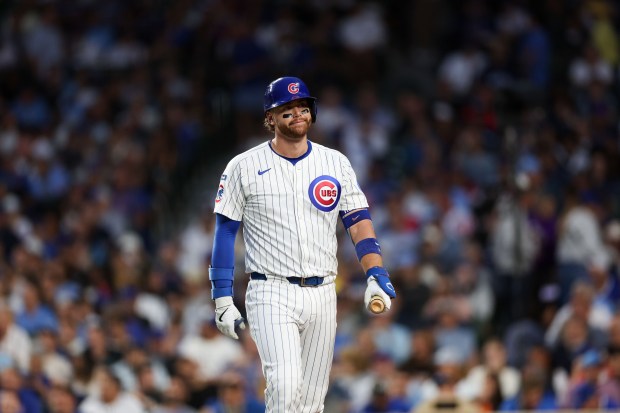 Chicago Cubs catcher Carson Kelly (15) walks to the dugout after striking out during the second inning against the Milwaukee Brewers at Wrigley Field on Wednesday, Aug. 20, 2025, in Chicago. (Armando L. Sanchez/Chicago Tribune)