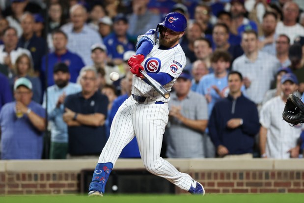 Chicago Cubs first baseman Michael Busch (29) hits a three-RBI double during the third inning against the Milwaukee Brewers at Wrigley Field on Wednesday, Aug. 20, 2025, in Chicago. (Armando L. Sanchez/Chicago Tribune)