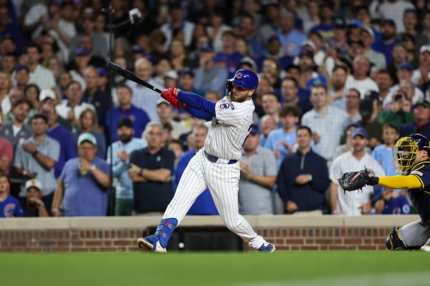 Chicago Cubs first baseman Michael Busch (29) hits a three-RBI double during the third inning against the Milwaukee Brewers at Wrigley Field on Wednesday, Aug. 20, 2025, in Chicago. (Armando L. Sanchez/Chicago Tribune)