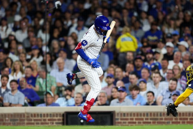 Chicago Cubs outfielder Pete Crow-Armstrong (4) jumps out of the way of a pitch from Milwaukee Brewers pitcher Shelby Miller (55) during the sixth inning at Wrigley Field on Wednesday, Aug. 20, 2025, in Chicago. (Armando L. Sanchez/Chicago Tribune)