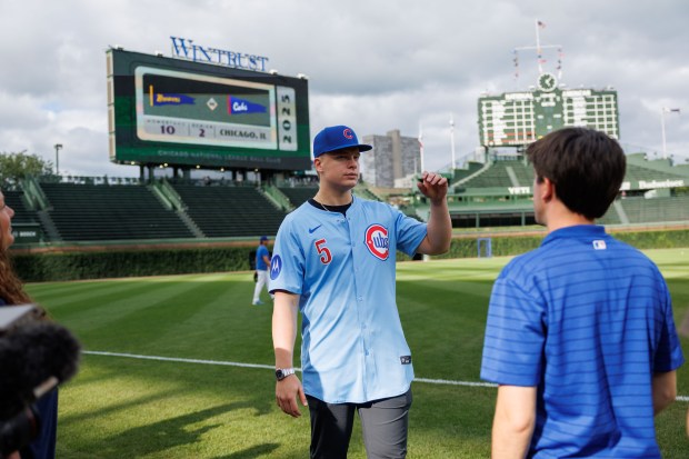 Ethan Conrad, who the Cubs selected at No. 17 in the first round of the 2025 MLB draft, walks on the field before the Cubs play the Milwaukee Brewers at Wrigley Field on Wednesday, Aug. 20, 2025, in Chicago. (Armando L. Sanchez/Chicago Tribune)