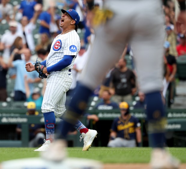Chicago Cubs relief pitcher Daniel Palencia celebrates after securing a victory by shutting down the Milwaukee Brewers in the ninth inning of Game 1 of a doubleheader at Wrigley Field in Chicago on Aug. 19, 2025. (Chris Sweda/Chicago Tribune)