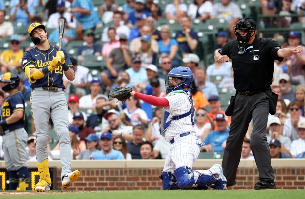 Milwaukee Brewers designated hitter Christian Yelich (22) reacts as he strikes out in the seventh inning of Game 1 of a doubleheader against the Chicago Cubs at Wrigley Field in Chicago on Aug. 19, 2025. (Chris Sweda/Chicago Tribune)