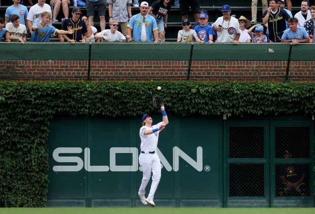 Chicago Cubs right fielder Owen Caissie (19) catches a fly ball in the fourth inning of Game 1 of a doubleheader against the Milwaukee Brewers at Wrigley Field in Chicago on Aug. 19, 2025. (Chris Sweda/Chicago Tribune)