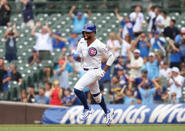 Chicago Cubs second baseman Willi Castro celebrates as he rounds the bases after hitting a 3-run home run in the third inning of Game 1 of a doubleheader against the Milwaukee Brewers at Wrigley Field in Chicago on Aug. 19, 2025. (Chris Sweda/Chicago Tribune)