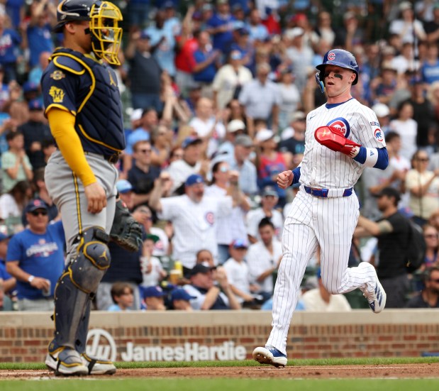 Chicago Cubs center fielder Pete Crow-Armstrong trots home to score on a 2-run single for teammate Owen Caissie in the first inning of Game 1 of a doubleheader against the Milwaukee Brewers at Wrigley Field in Chicago on Aug. 19, 2025. (Chris Sweda/Chicago Tribune)