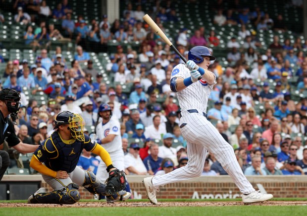 Chicago Cubs right fielder Owen Caissie drives in two runs on a single in the first inning of Game 1 of a doubleheader against the Milwaukee Brewers at Wrigley Field in Chicago on Aug. 19, 2025. (Chris Sweda/Chicago Tribune)