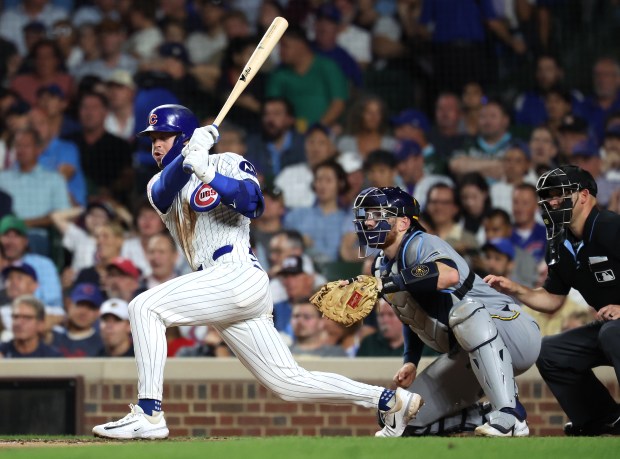 Chicago Cubs second baseman Nico Hoerner drives in a run on a single in the fifth inning of Game 2 of a doubleheader against the Milwaukee Brewers at Wrigley Field in Chicago on Aug. 19, 2025. (Chris Sweda/Chicago Tribune)