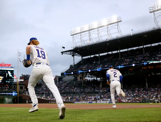 Chicago Cubs right fielder Owen Caissie (19) takes the field for Game 2 of a doubleheader against the Milwaukee Brewers at Wrigley Field on Aug. 19, 2025. (Chris Sweda/Chicago Tribune)