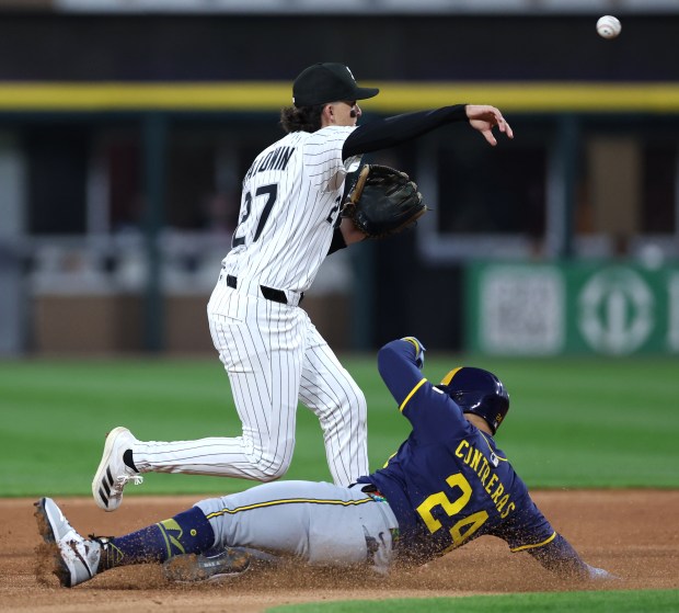 Chicago White Sox shortstop Brooks Baldwin throws to first base as Milwaukee Brewers catcher William Contreras (24) slides in safely at second base after Baldwin didn't keep his foot on the bag in the third inning of a game at Rate Field in Chicago on April 30, 2025. (Chris Sweda/Chicago Tribune)