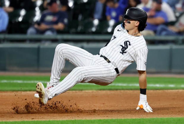 Chicago White Sox left fielder Brooks Baldwin slips and falls after rounding first base following a single in the sixth inning of a game against the Kansas City Royals at Rate Field in Chicago on Aug. 26, 2025. (Chris Sweda/Chicago Tribune)