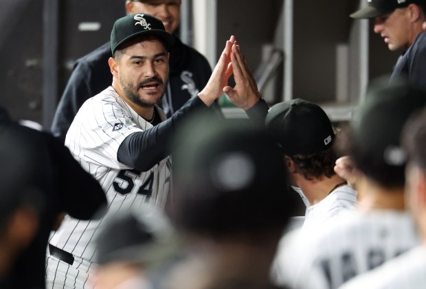 Chicago White Sox starting pitcher Martín Pérez receives high-fives in the dugout after shutting down the Kansas City Royals in the seventh inning of a game at Rate Field in Chicago on Aug. 26, 2025. (Chris Sweda/Chicago Tribune)