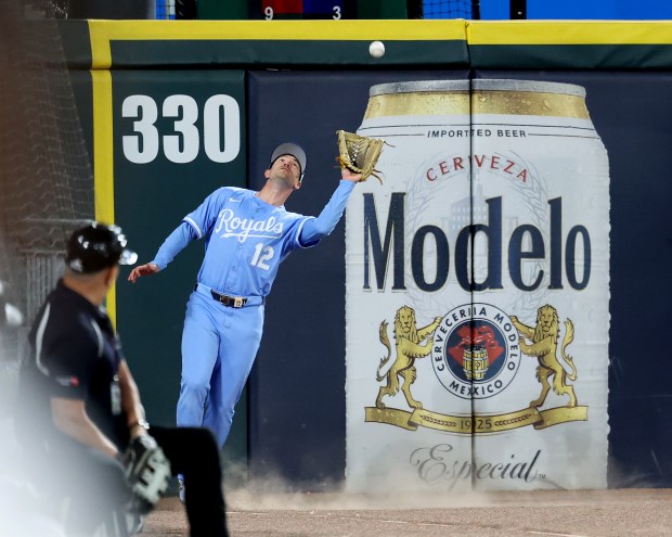Kansas City Royals left fielder Nick Loftin (12) catches a long fly ball hit by Chicago White Sox left fielder Brooks Baldwin in the seventh inning of a game at Rate Field in Chicago on Aug. 26, 2025. (Chris Sweda/Chicago Tribune)