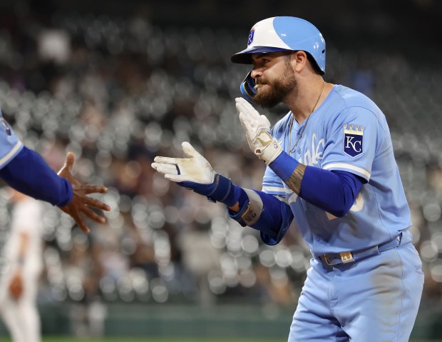 Kansas City Royals hitter Kyle Isbel celebrates at first base after driving in a run on a single in the ninth inning of a game against the Chicago White Sox at Rate Field in Chicago on Aug. 26, 2025. (Chris Sweda/Chicago Tribune)