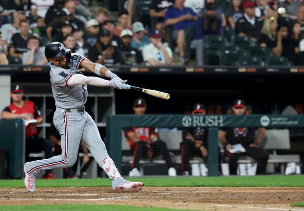 Minnesota Twins third baseman Royce Lewis hits a grand slam in the fourth inning of a game against the Chicago White Sox at Rate Field in Chicago on Aug. 22, 2025. (Chris Sweda/Chicago Tribune)