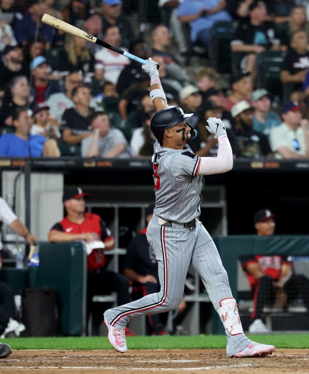 Minnesota Twins third baseman Royce Lewis hits a grand slam in the fourth inning of a game against the Chicago White Sox at Rate Field in Chicago on Aug. 22, 2025. (Chris Sweda/Chicago Tribune)