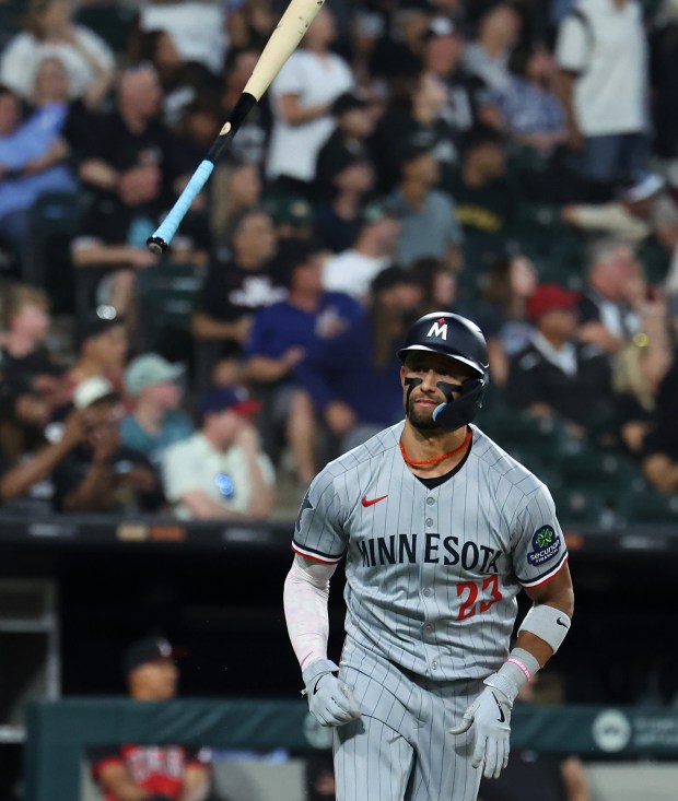 Minnesota Twins third baseman Royce Lewis flips his bat in the air after hitting a grand slam in the fourth inning of a game against the Chicago White Sox at Rate Field in Chicago on Aug. 22, 2025. (Chris Sweda/Chicago Tribune)