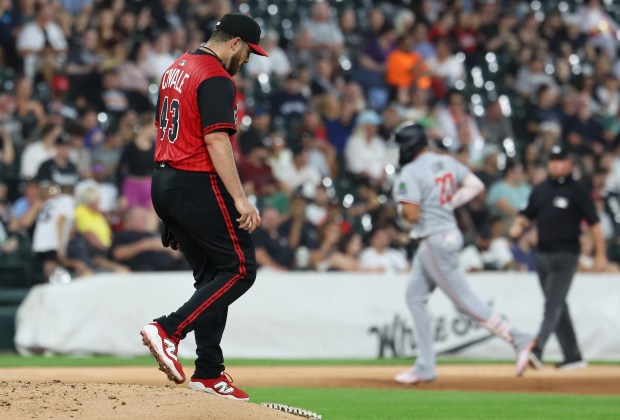 Chicago White Sox starting pitcher Aaron Civale walks off the mound as Minnesota Twins third baseman Royce Lewis (background) rounds the bases after hitting a grand slam in the fourth inning of a game at Rate Field in Chicago on Aug. 22, 2025. (Chris Sweda/Chicago Tribune)