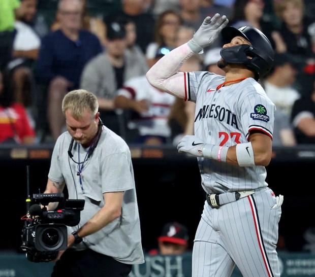 Minnesota Twins third baseman Royce Lewis celebrates before crossing home plate after hitting a grand slam in the fourth inning of a game against the Chicago White Sox at Rate Field in Chicago on Aug. 22, 2025. (Chris Sweda/Chicago Tribune)