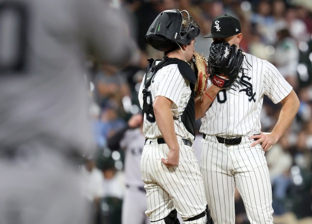 Chicago White Sox catcher Kyle Teel and relief pitcher Tyler Alexander talk on the mound during the 11th inning of a game against the New York Yankees at Rate Field in Chicago on Aug. 30, 2025. (Chris Sweda/Chicago Tribune)