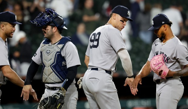 Designated hitter Aaron Judge (99) and his New York Yankees teammates celebrates after a victory over the Chicago White Sox at Rate Field in Chicago on Aug. 30, 2025. (Chris Sweda/Chicago Tribune)