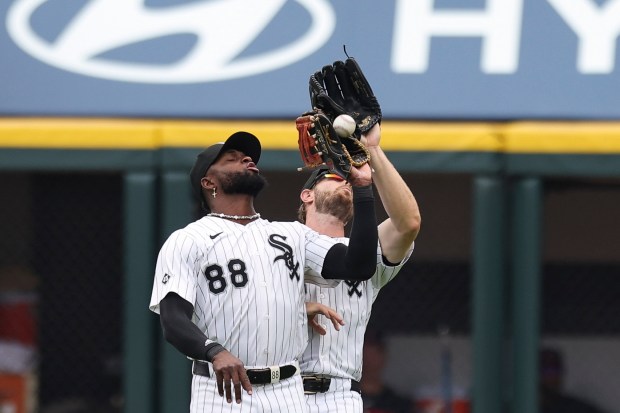 Chicago White Sox outfielders Luis Robert Jr. (88) and Austin...