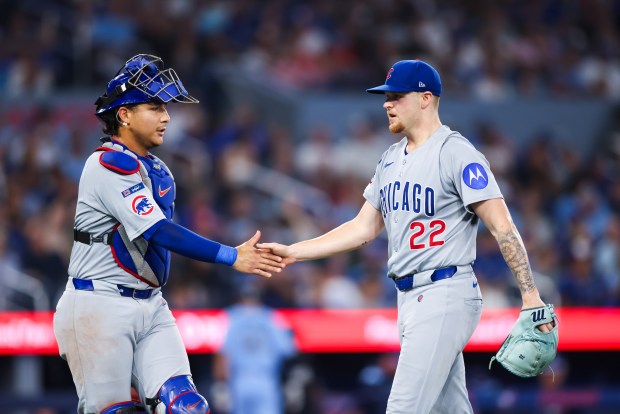 Miguel Amaya #9 of the Chicago Cubs celebrates at the end of the first inning with Cade Horton #22 during their MLB game against the Toronto Blue Jays at Rogers Centre on Aug. 13, 2025 in Toronto, Ontario, Canada. (Photo by Cole Burston/Getty Images)