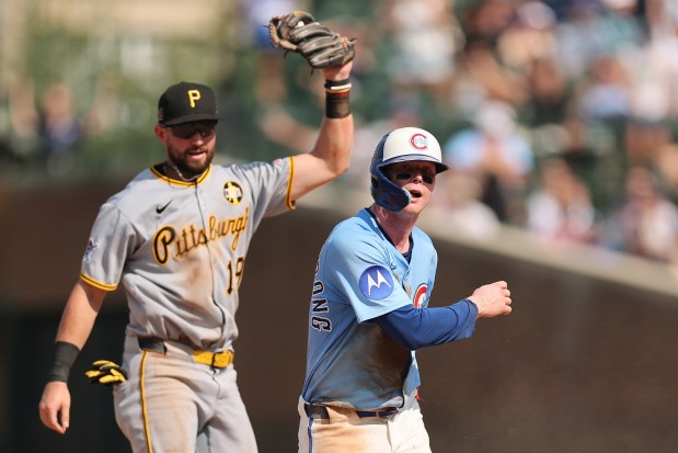Cubs center fielder Pete Crow-Armstrong walks toward the dugout after being tagged out by Pirates shortstop Jared Triolo after sliding past second base on a steal attempt during the ninth inning on Friday, Aug. 15, 2025, at Wrigley Field. (Michael Reaves/Getty Images)