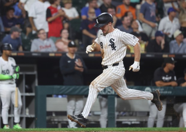 Chicago White Sox catcher Kyle Teel (8) scores during the fifth inning of a baseball game against the Detroit Tigers, Tuesday, Aug. 12, 2025, in Chicago. (AP Photo/Talia Sprague)