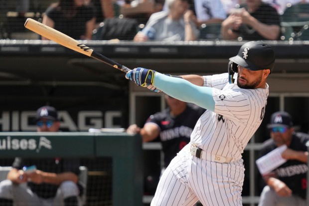 Chicago White Sox's Edgar Quero hits a two-run single during the first inning of a baseball game against the Minnesota Twins in Chicago, Sunday, Aug. 24, 2025. (AP Photo/Nam Y. Huh)