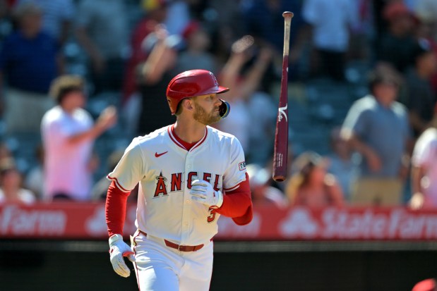 Los Angeles Angels' Taylor Ward flips his bat as he watches his three-run walkoff home run during the ninth inning of a baseball game against the Chicago White Sox, Sunday, Aug. 3, 2025, in Anaheim, Calif. (AP Photo/Jayne Kamin-Oncea)
