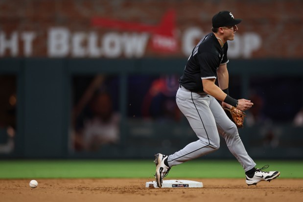 Chicago White Sox shortstop Colson Montgomery records an error on a ground ball in the fourth inning of a baseball game against the Atlanta Braves, Wednesday, Aug. 20, 2025, in Atlanta. (AP Photo/Colin Hubbard)