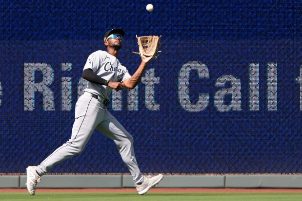 Chicago White Sox right fielder Michael A. Taylor catches a fly ball for the out on Kansas City Royals' Luke Maile during the seventh inning of a baseball game Sunday, Aug. 17, 2025, in Kansas City, Mo. (AP Photo/Charlie Riedel)