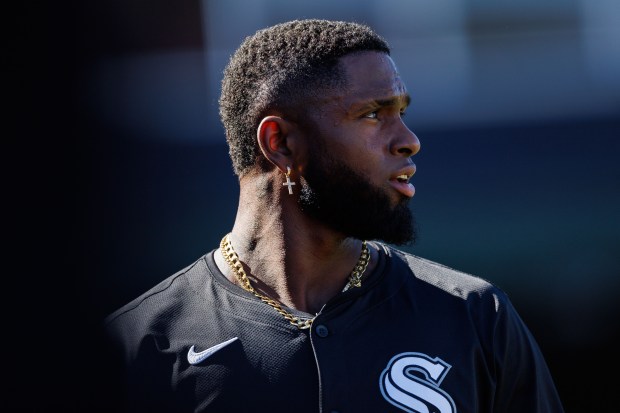 White Sox outfielder Luis Robert Jr. walks through the dugout...