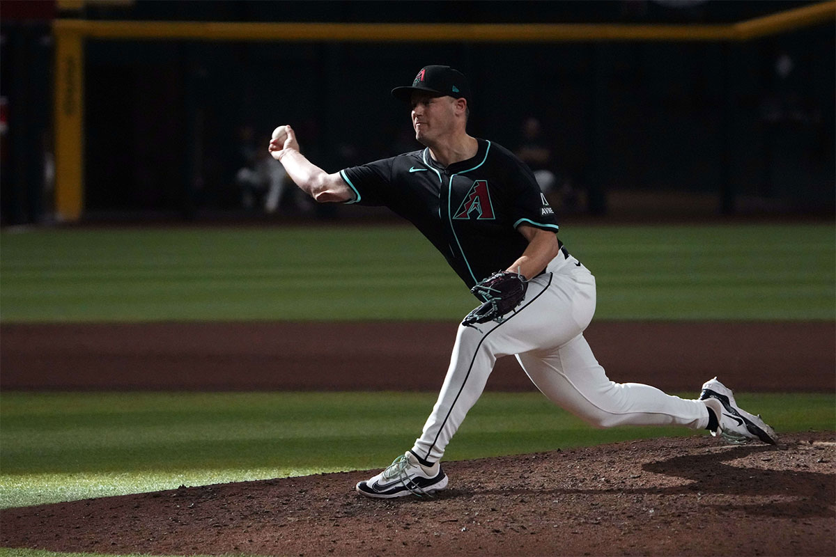 Arizona Diamondbacks pitcher Paul Sewald (38) pitches against the Los Angeles Dodgers during the ninth inning at Chase Field.