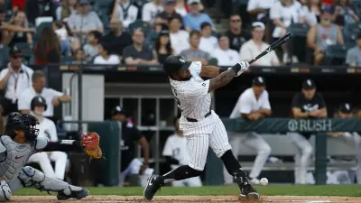 Aug 9, 2025; Chicago, Illinois, USA; Chicago White Sox outfielder Corey Julks (32) singles against the Cleveland Guardians during the second inning at Rate Field.