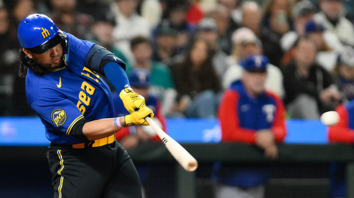 Sep 29, 2023; Seattle, Washington, USA; Seattle Mariners third baseman Eugenio Suarez (28) hits an RBI double against the Texas Rangers during the third inning at T-Mobile Park.