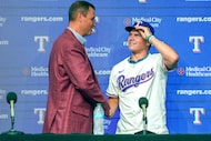 Texas Rangers first-round pick Gavin Fien shakes hands with president of baseball operations...