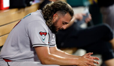 Relief pitcher Juan Morillo #67 of the Arizona Diamondbacks reacts in the dugout after going up fou...