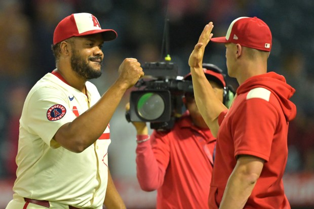 Angels relief pitcher Kenley Jansen, left, celebrates his 20th save of the season with teammate Logan O'Hoppe after their 8-5 victory over the Texas Rangers on Tuesday, July 29, 2025, at Angel Stadium. (Photo by Jayne Kamin-Oncea/Getty Images)