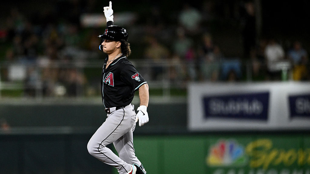 Alek Thomas #5 of the Arizona Diamondbacks reacts after hitting a solo home run in against the Athl...