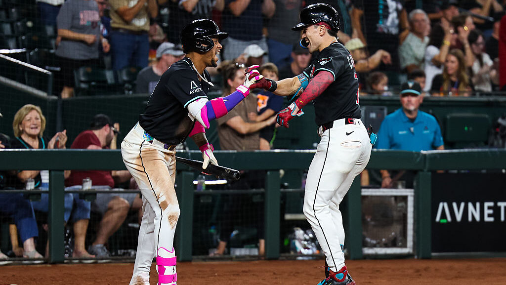 Ketel Marte #4 of the Arizona Diamondbacks celebrates with Corbin Carroll #7...