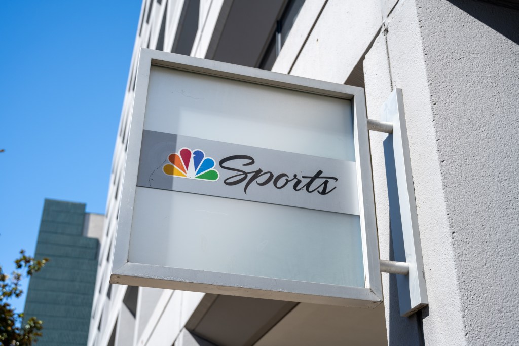 NBC Sports sign featuring multicolor peacock logo on office building facade, San Francisco