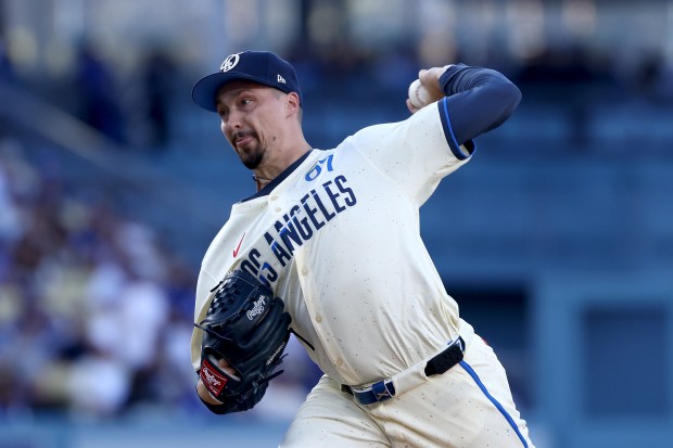 Dodgers starting pitcher Blake Snell throws to the plate during...