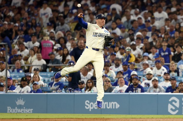 Dodgers first baseman Freddie Freeman throws to first base during...